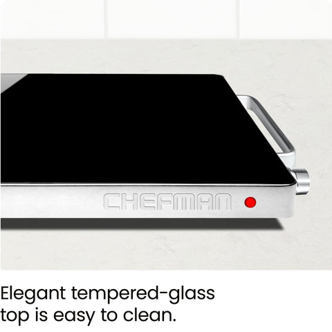 Chefman cool-touch aluminum handles being held for safe transport and serving