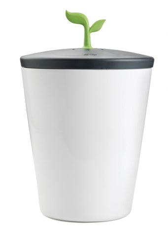 Chef'n EcoCrock front view showing sleek black and white ceramic design and tidy storage benefit