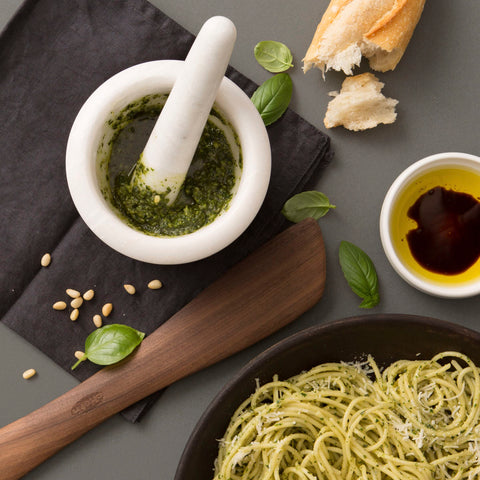 Chef'n mortar filled with homemade pesto showing smooth texture and convenience