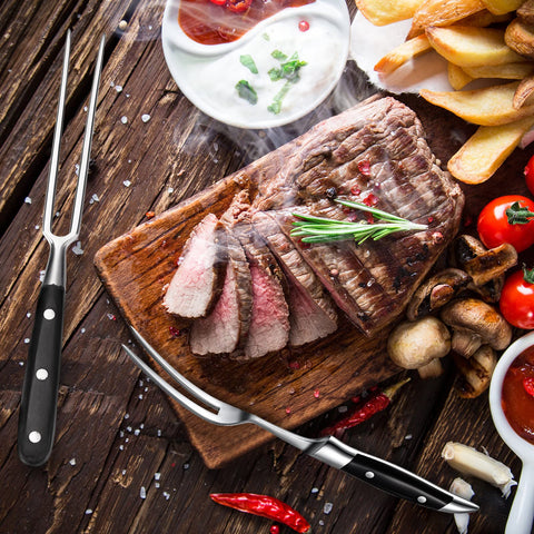 CHENGU fork turning steak on grill showing heat-resistant handling benefit