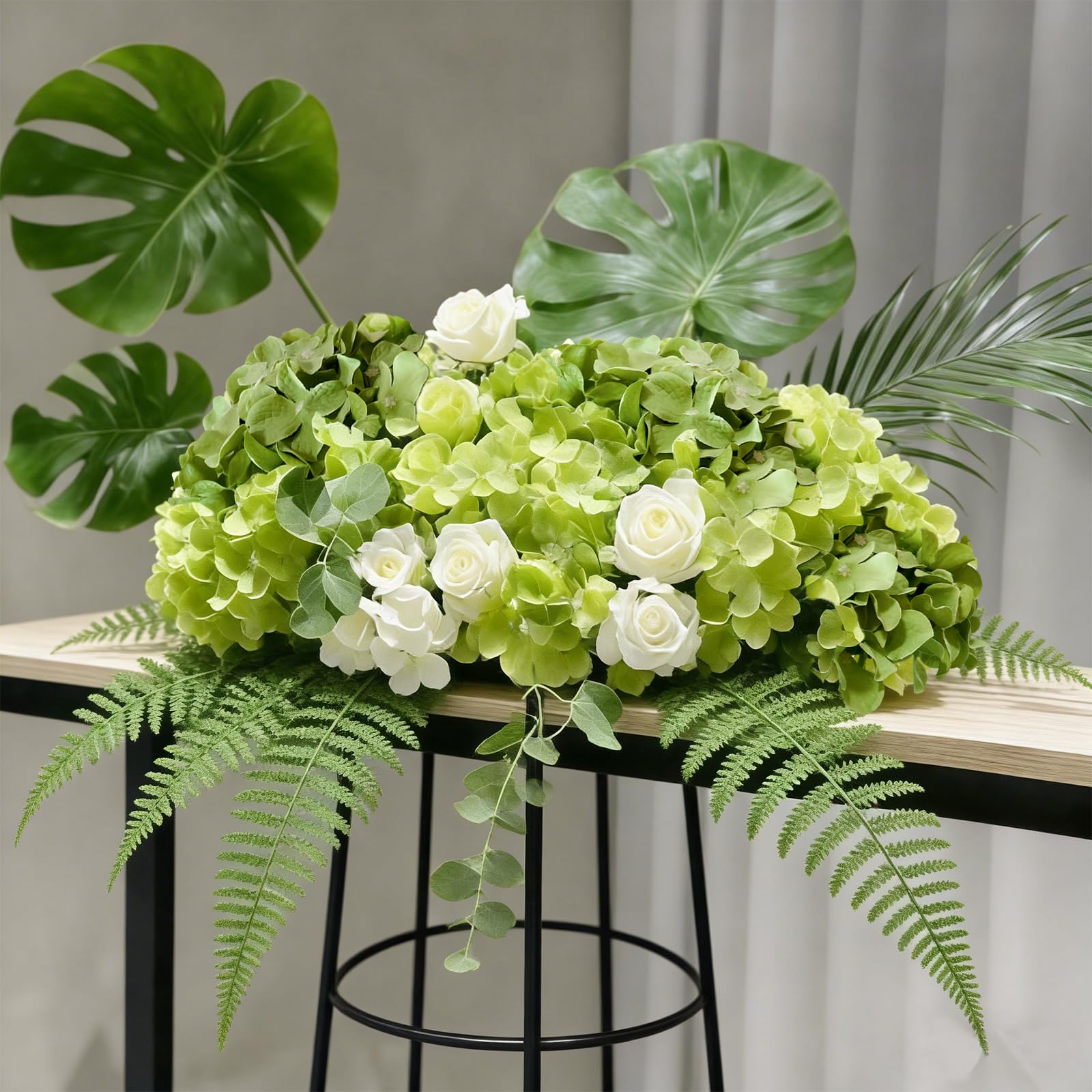 Cherica arranged hydrangeas in a vase demonstrating elegant centerpiece impact