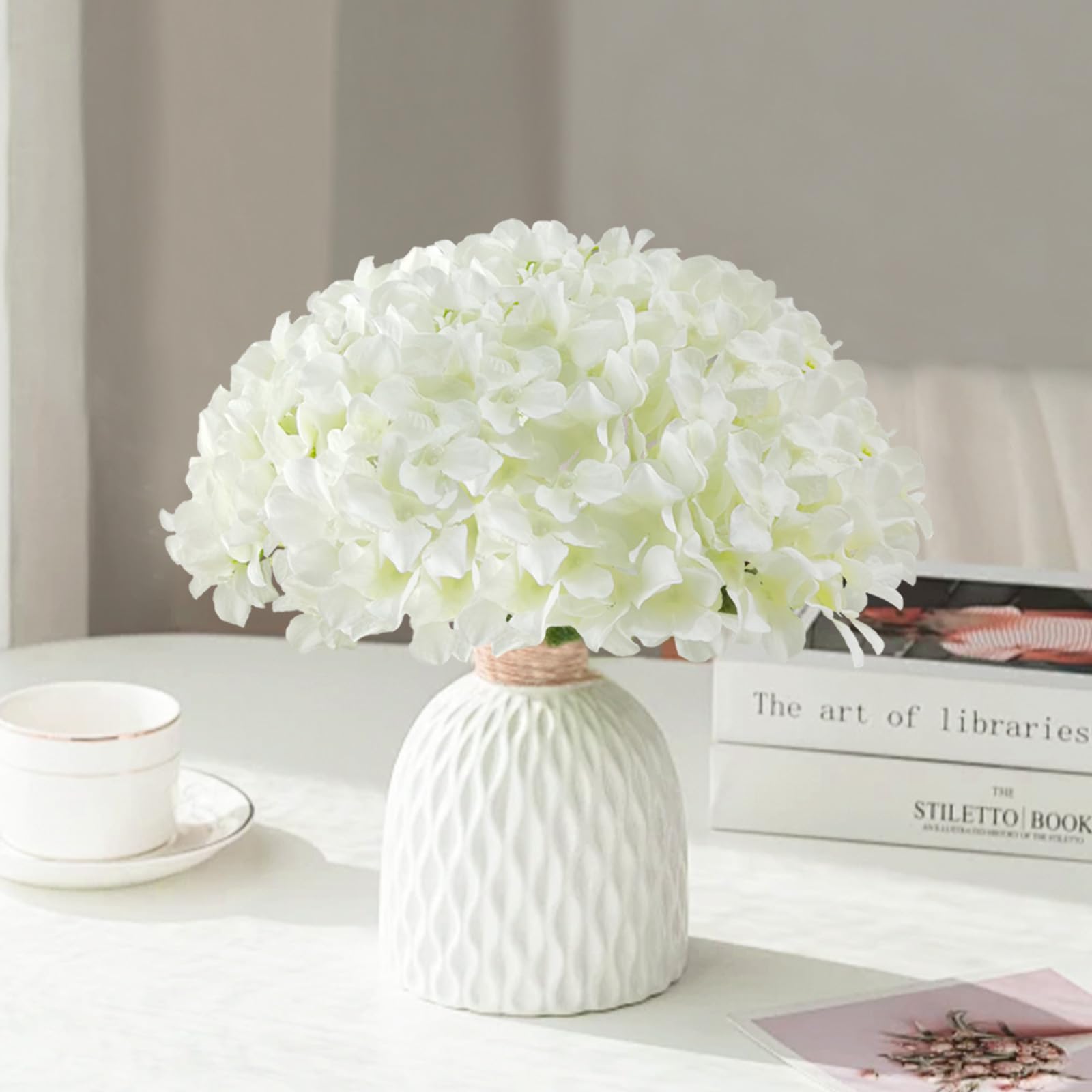 Cherica hydrangeas in a vase on living room table adding timeless decor