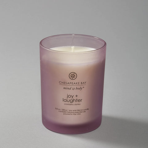 Chesapeake Bay Candle staged in living room showing mood-setting fragrance benefit