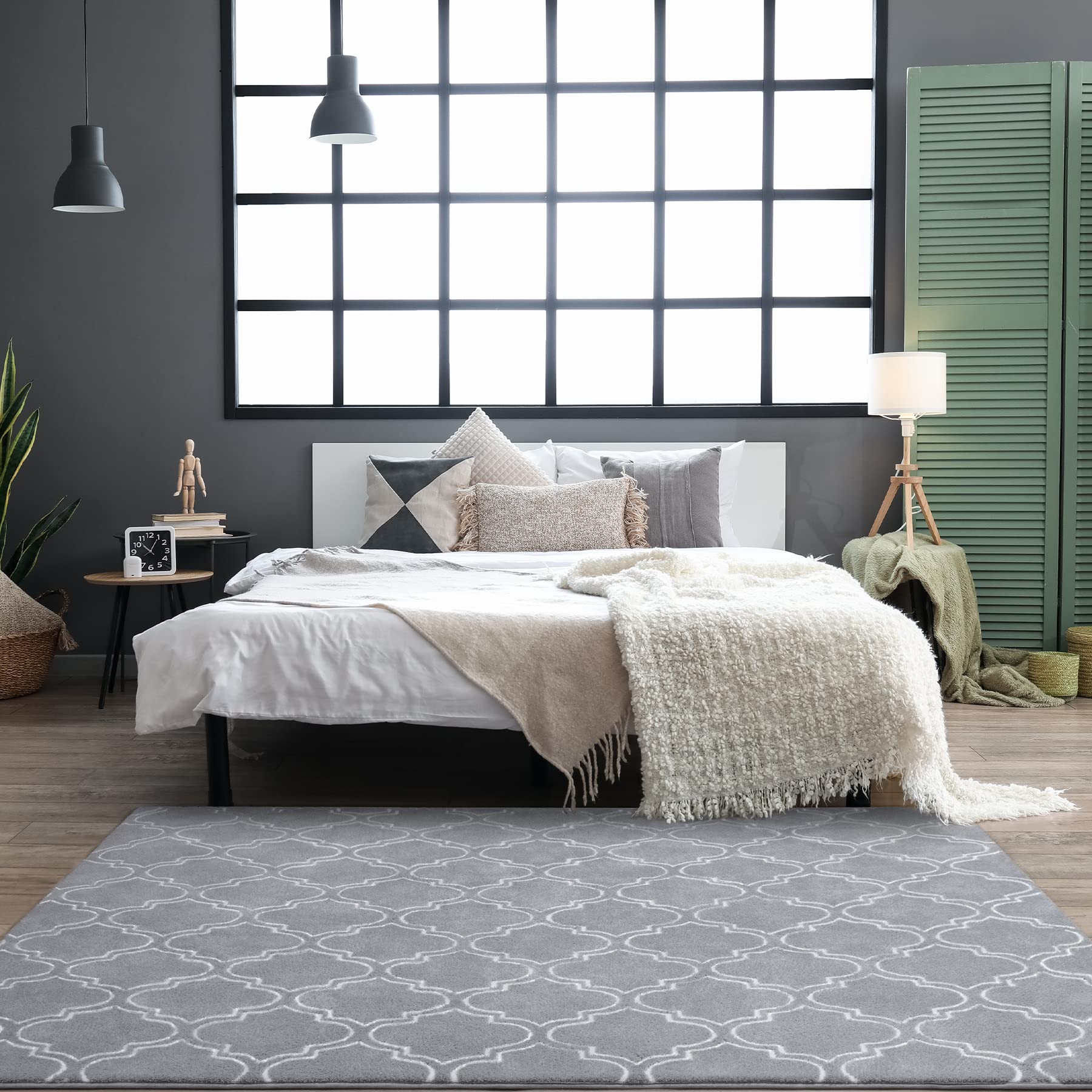 Chicrug styled beside a bed illustrating cozy bedside warmth and decor boost