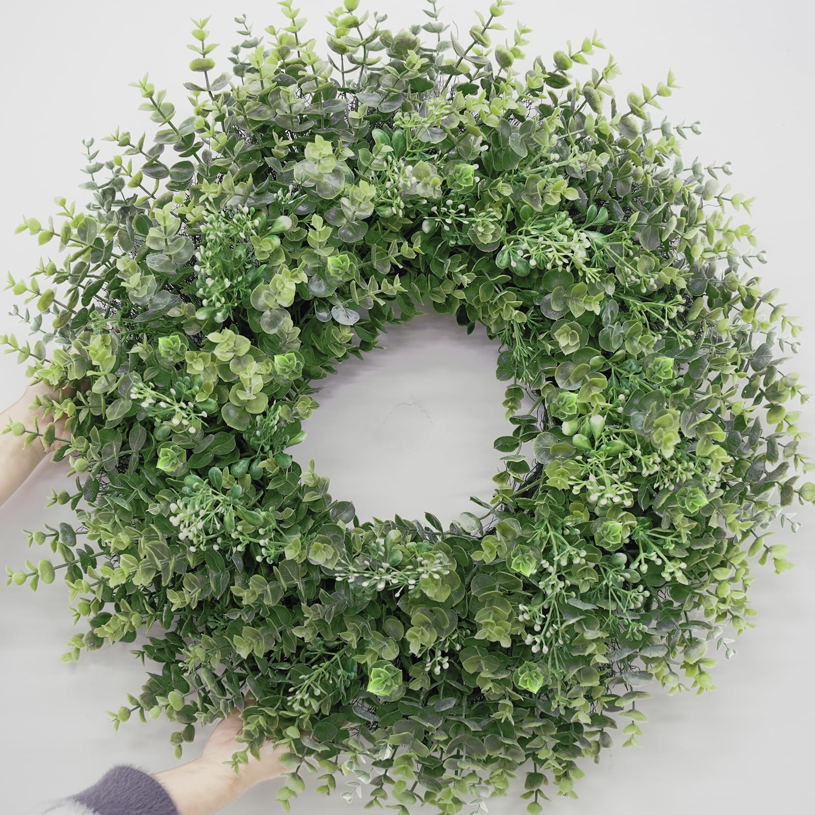 Chiyinbao wreath on front door showing full greenery and curb appeal