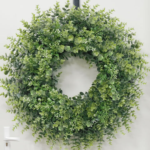Chiyinbao wreath hung on porch delivering weatherproof decorative benefit