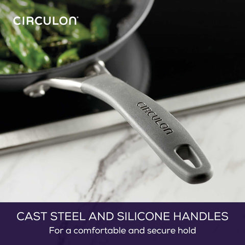 Circulon frying pan searing steak to show high-heat performance and nonstick release