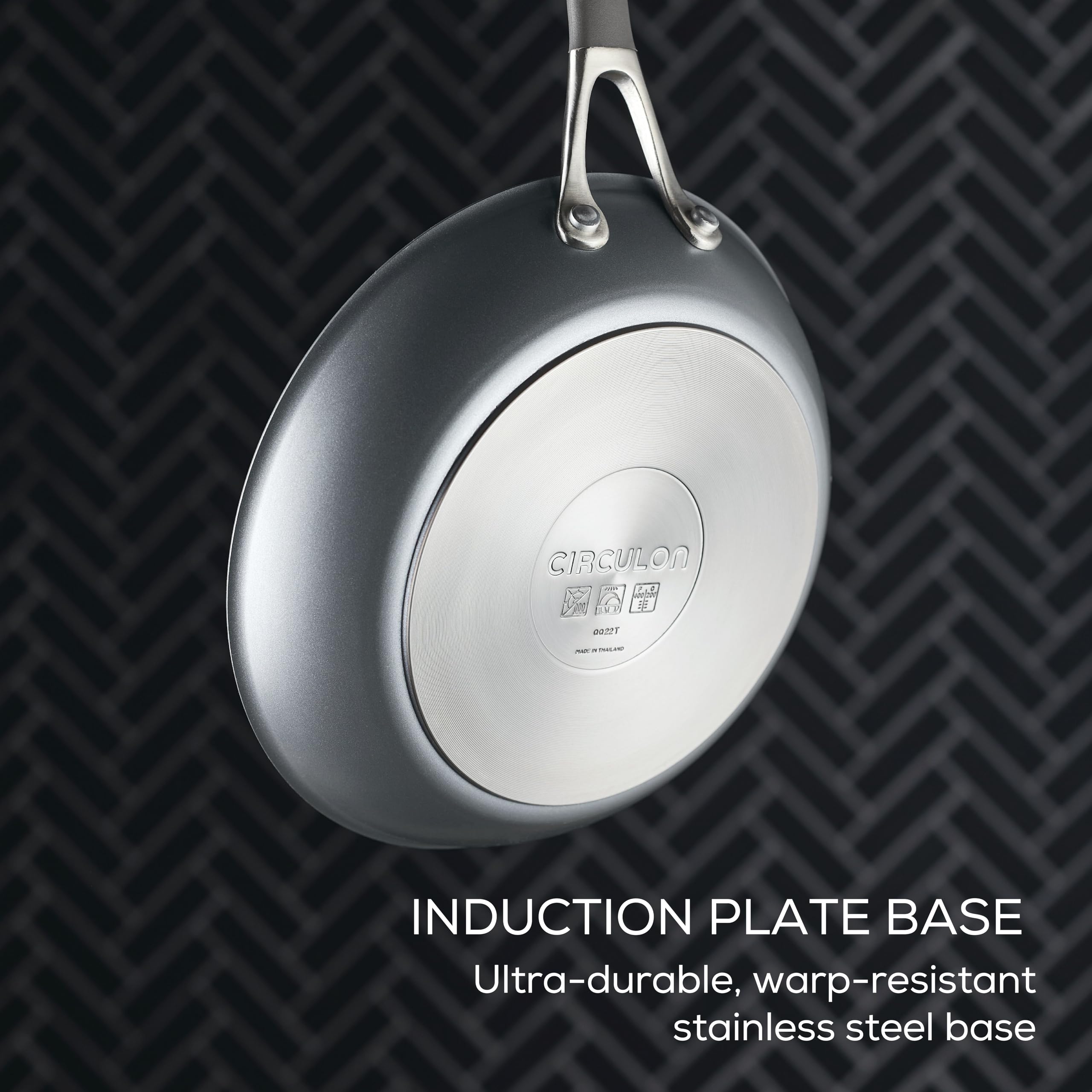 Circulon handle closeup showing cast stainless steel and silicone for secure grip