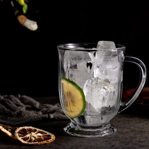 Claplante hand holding a 15 oz mug showing true-to-scale capacity