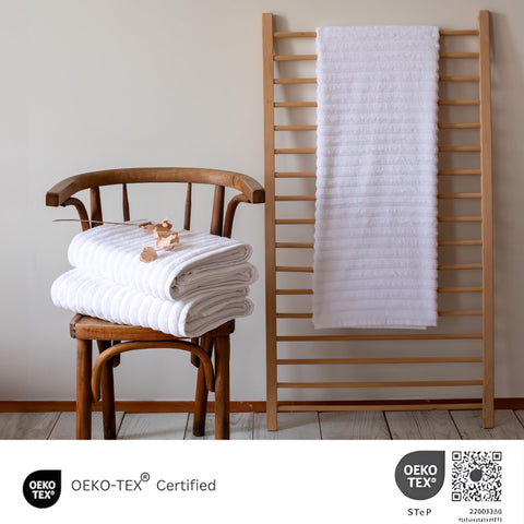 Classic Turkish Towels CTT neatly folded stack demonstrating plush thickness and storage benefit