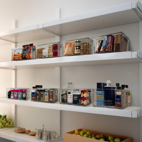 ClearSpace filled bins organizing pantry snacks and condiments for quick access