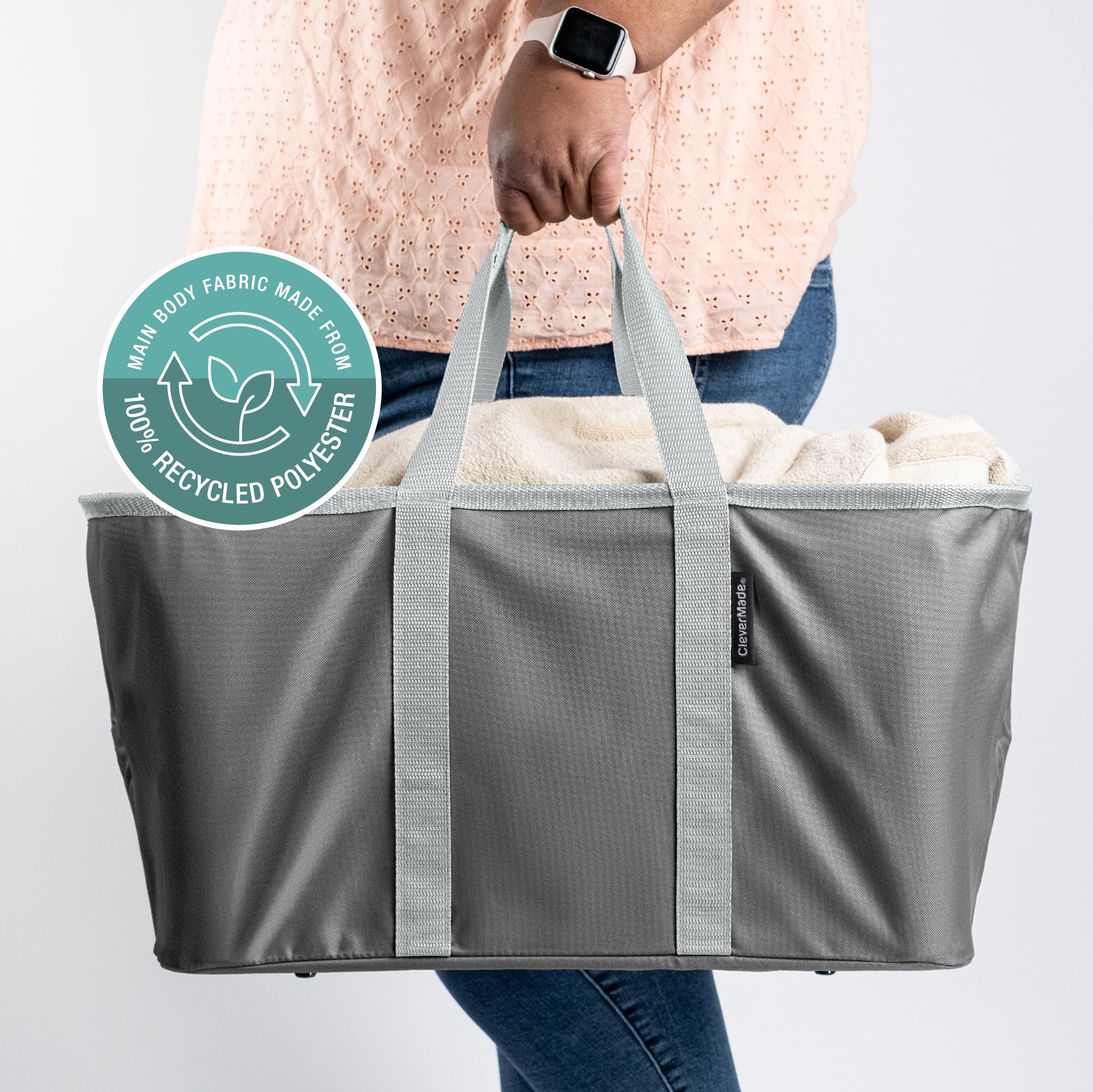 CleverMade tote at beach holding towels and toys for easy portable organization
