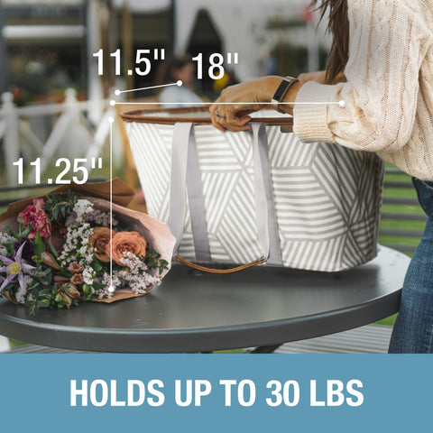 CleverMade tote in use loading groceries into an upright, easy-to-fill bag