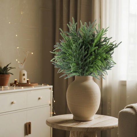 Cllayees stems being wired into a wreath adding realistic depth and durable fill