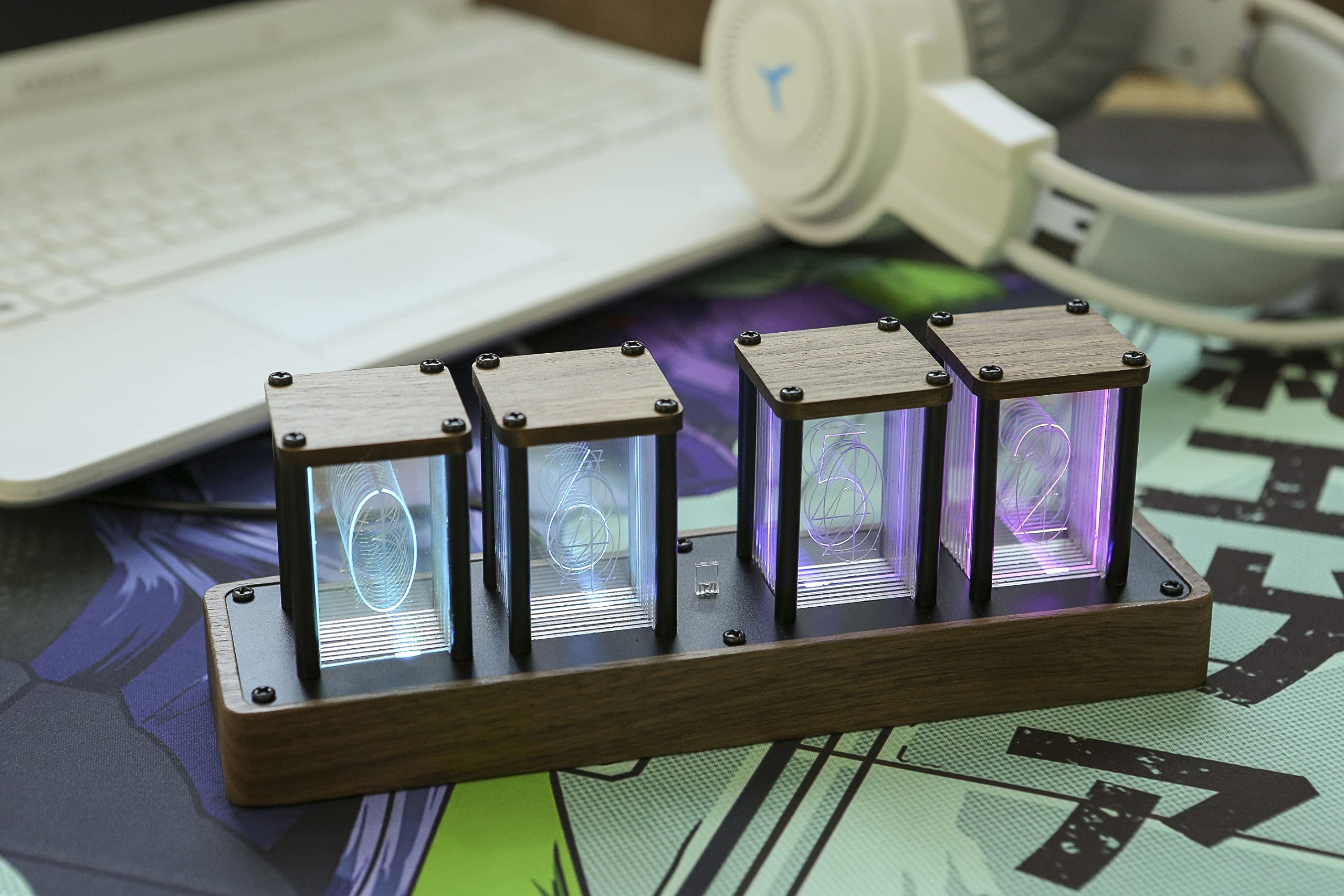 ClocTeck next to a smartphone showing compact scale and desk suitability benefit