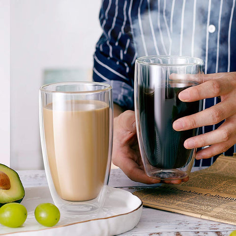 CNGLASS hand holding mug demonstrating protected grip and no-burn benefit
