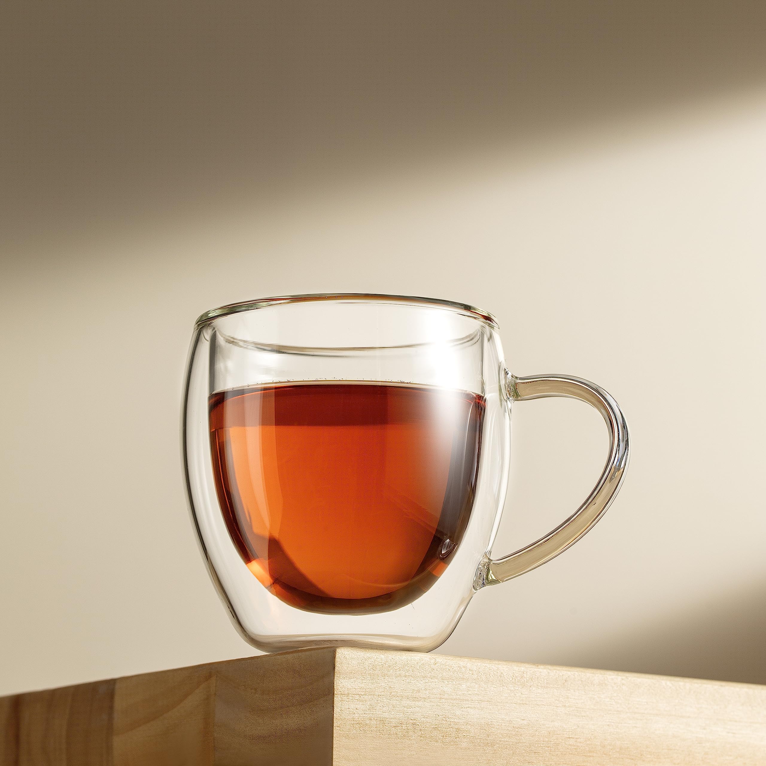 CNGLASS in-use espresso pour into mug highlighting preserved crema and pouring control