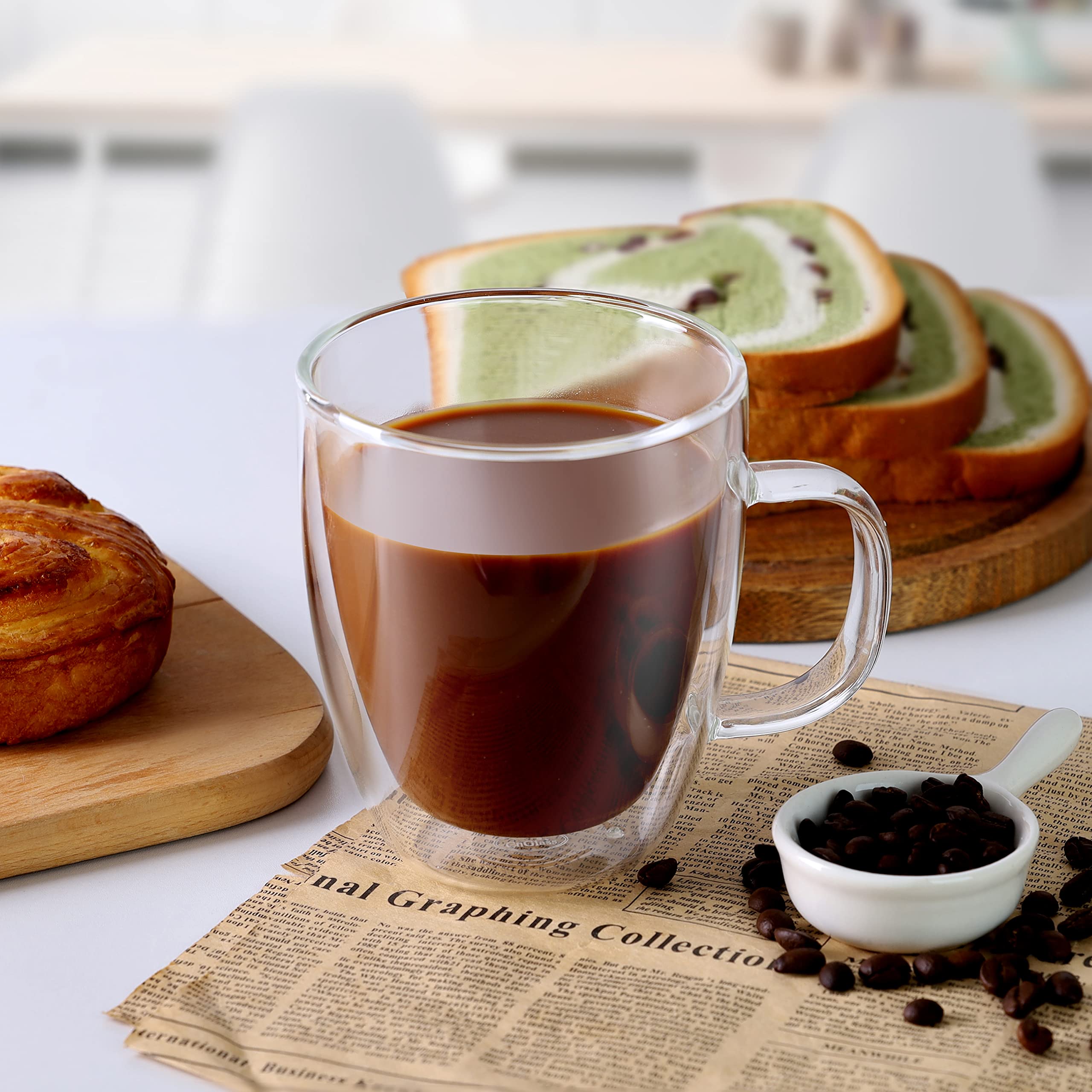 CNGLASS mug held in hand demonstrating comfortable handle and cool-touch safety benefit