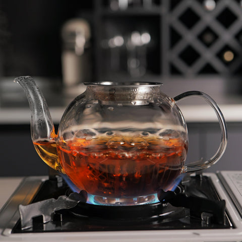 CNGLASS teapot with blooming tea in use displaying leaf expansion and visual brewing benefit