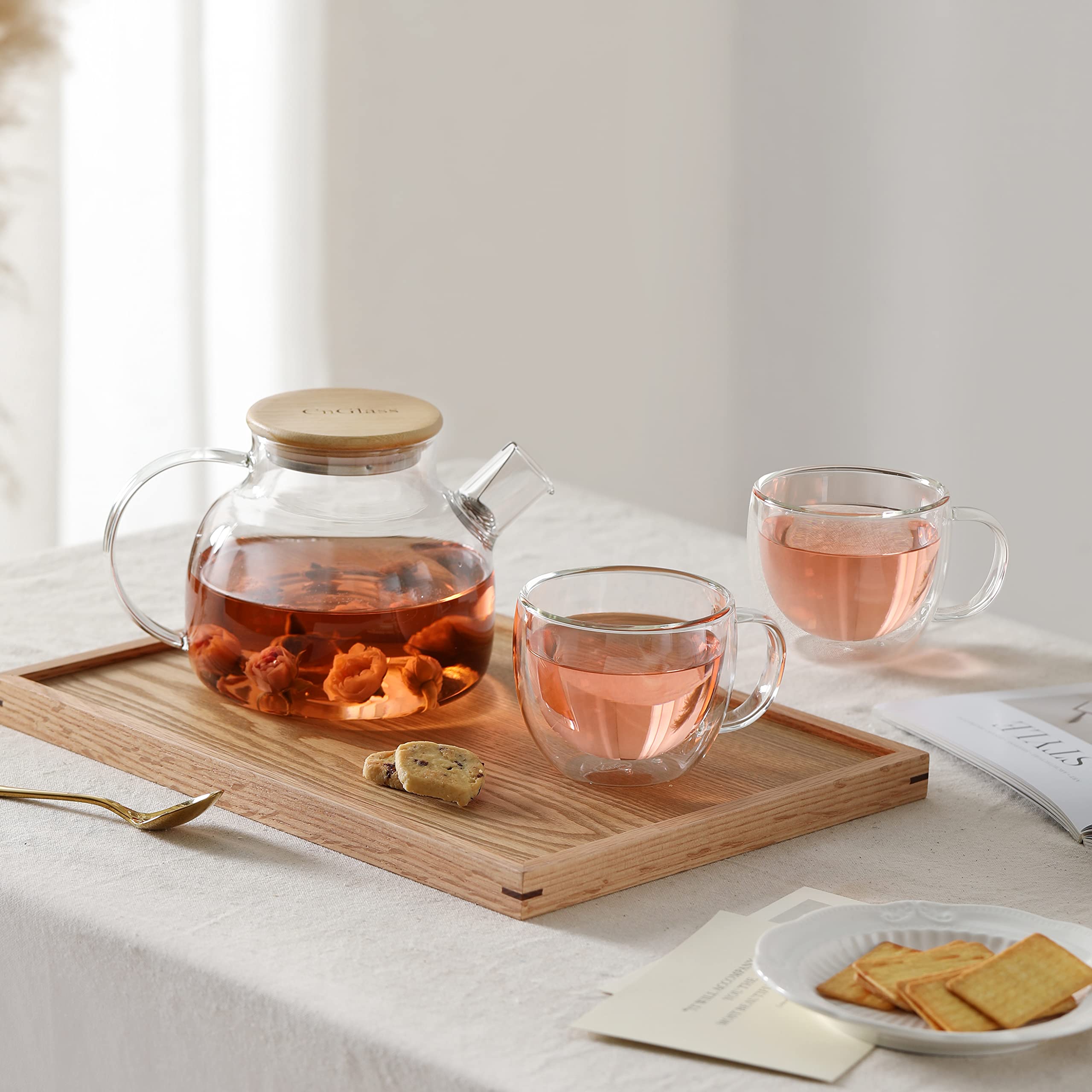 CNGLASS teapot on stovetop demonstrating heat-safe borosilicate glass use