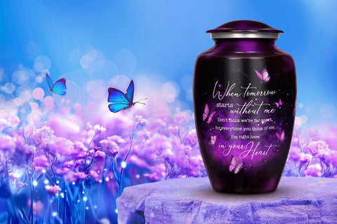 Cogent Memorials urn next to hand for scale showing suitable adult capacity