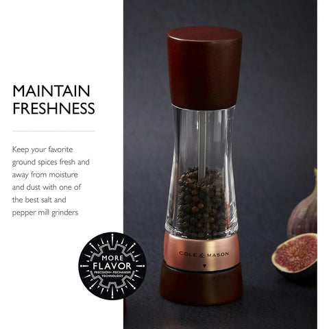 Cole & Mason mill in use seasoning steak for immediate flavor control and table-side convenience
