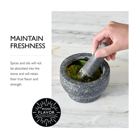 Cole & Mason mortar in use crushing spices to release fresh aromas