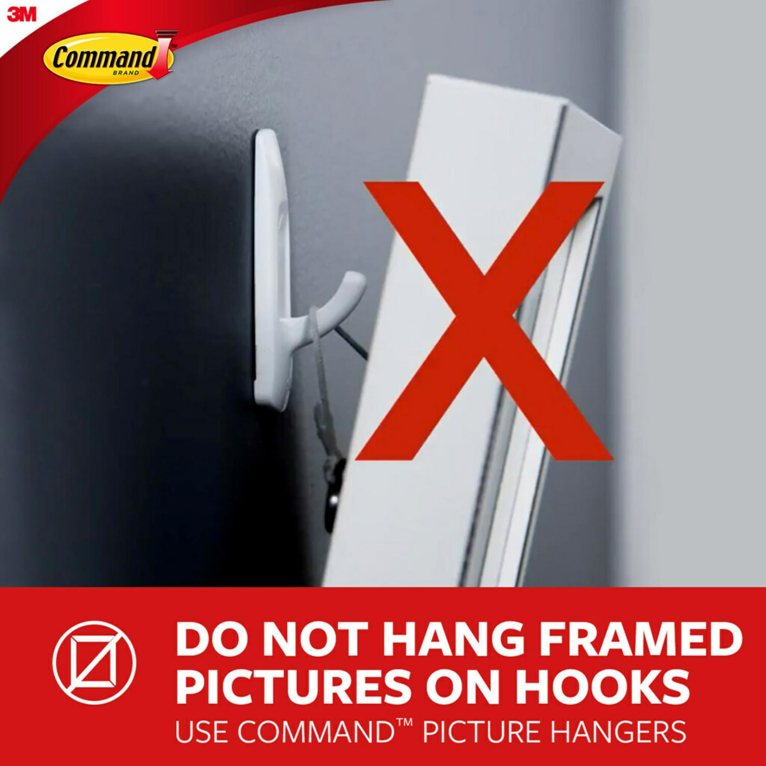 Command hook beside a coin for scale showing compact size and discreet look