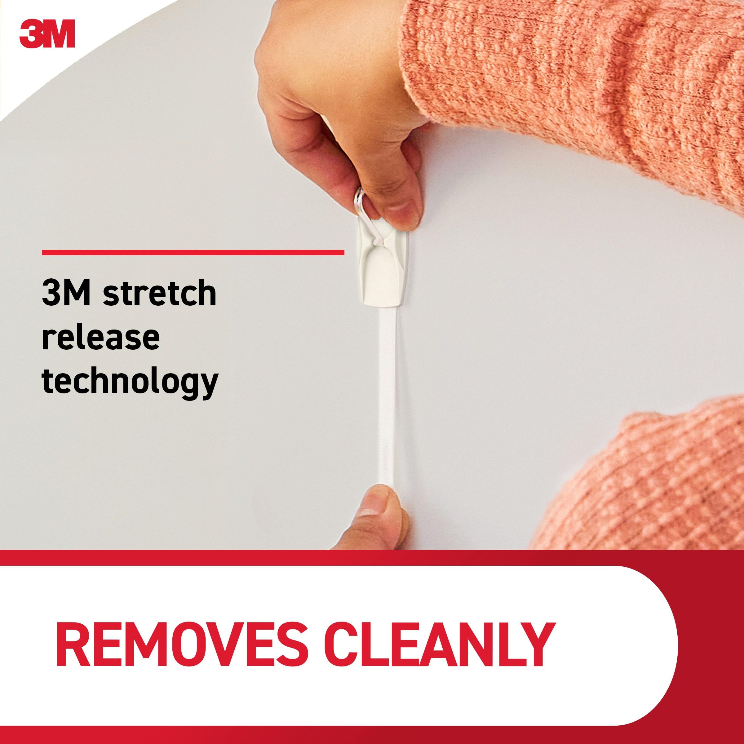Command medium hook removal demonstration showing clean pull-down removal benefit