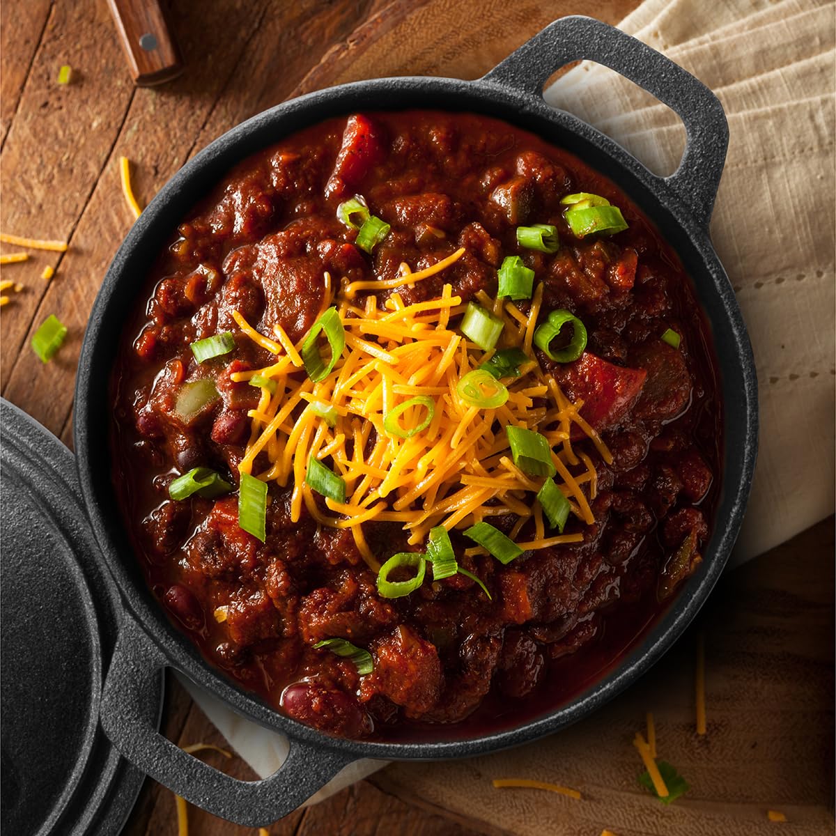 Commercial Chef Dutch oven over campfire demonstrating outdoor cooking versatility