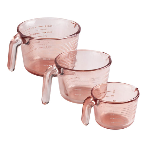 COOK WITH COLOR front view of pink measuring cups set showing sizes and color benefits