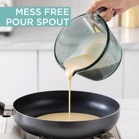 COOK WITH COLOR handle and spout detail for secure grip and drip-free pour