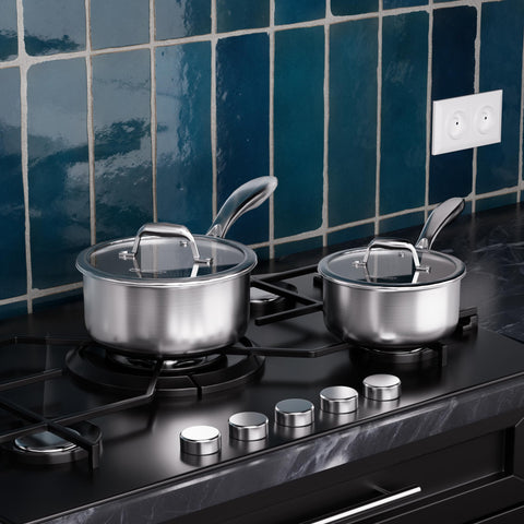 COOKER KING saucepan beside measuring cup illustrating 1.5 qt and 2 qt size scale
