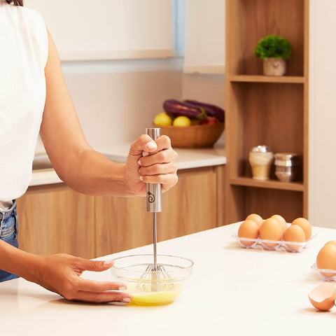 Cooks Innovations whisks on dishwasher top rack indicating easy cleanup and time savings