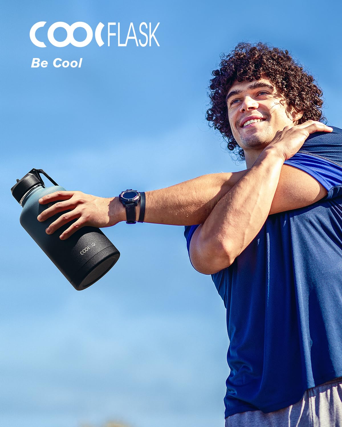 Coolflask next to backpack to show 64oz capacity and travel convenience