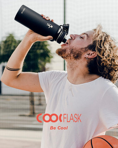 Coolflask next to a backpack showing 40 oz capacity and travel-friendly portability