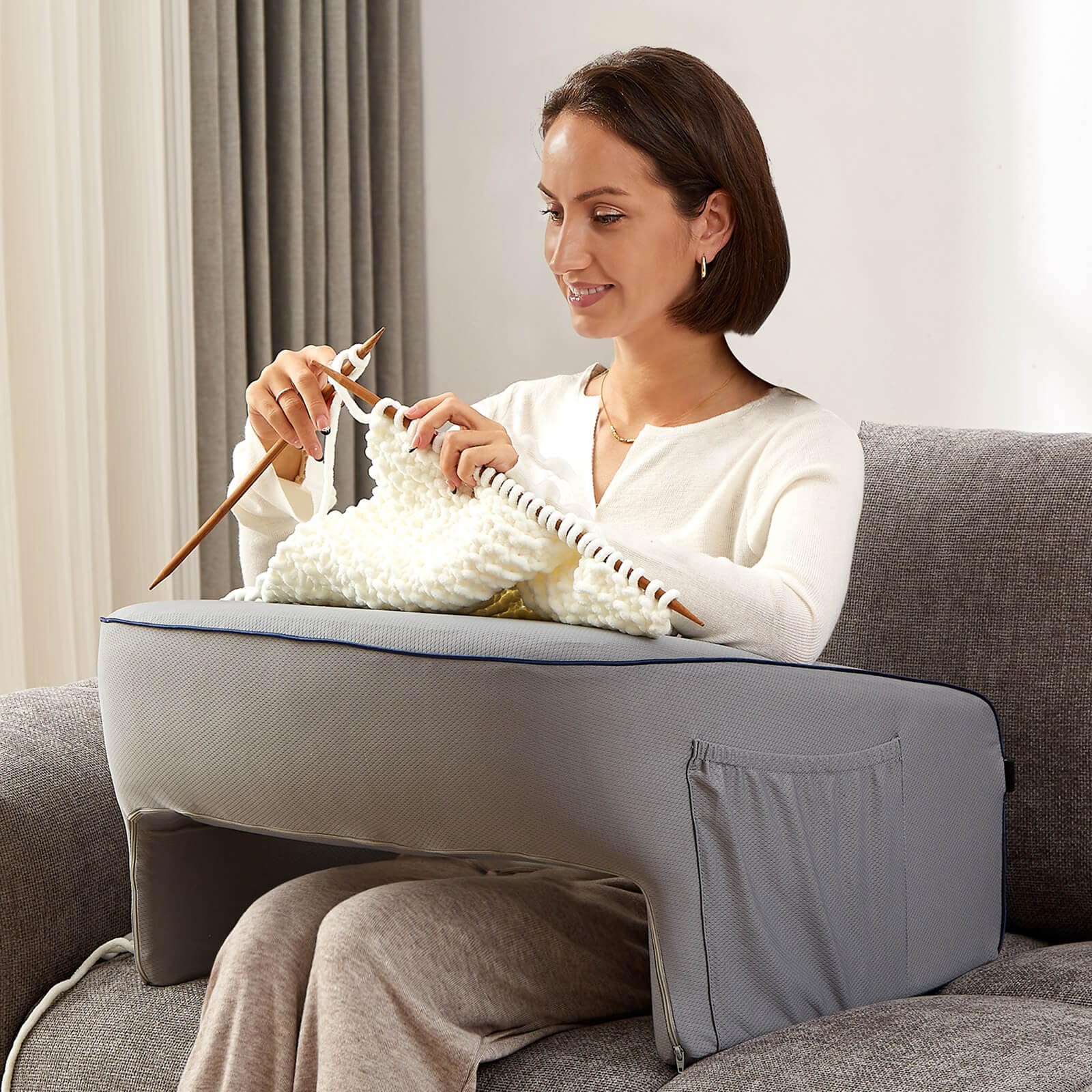 cooloo8 lifestyle shot on bed and sofa showing portable comfort in home settings