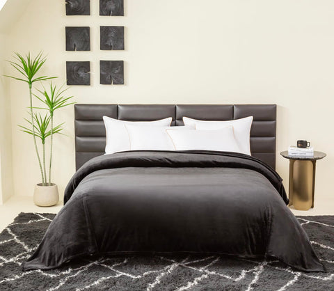 COOVA blanket spread on king bed demonstrating roomy fit