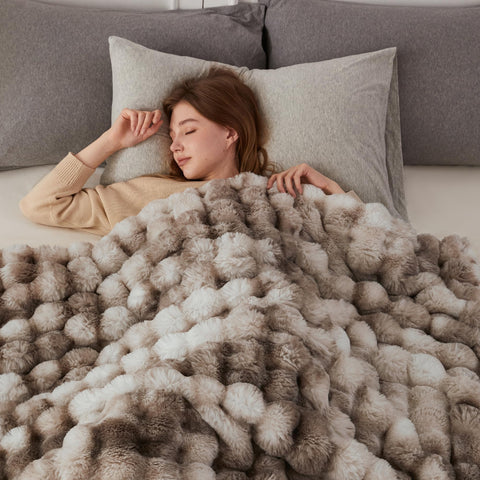COOVA folded blanket beside ruler showing 60x80 size and scale