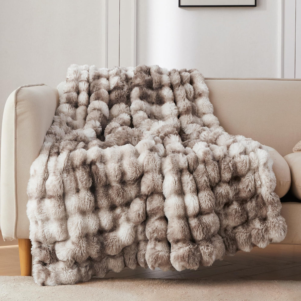 COOVA faux fur throw on sofa showing drape and cozy appeal