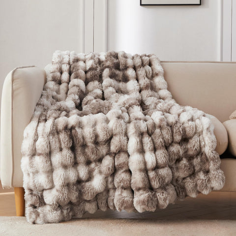 COOVA faux fur throw on sofa showing drape and cozy appeal