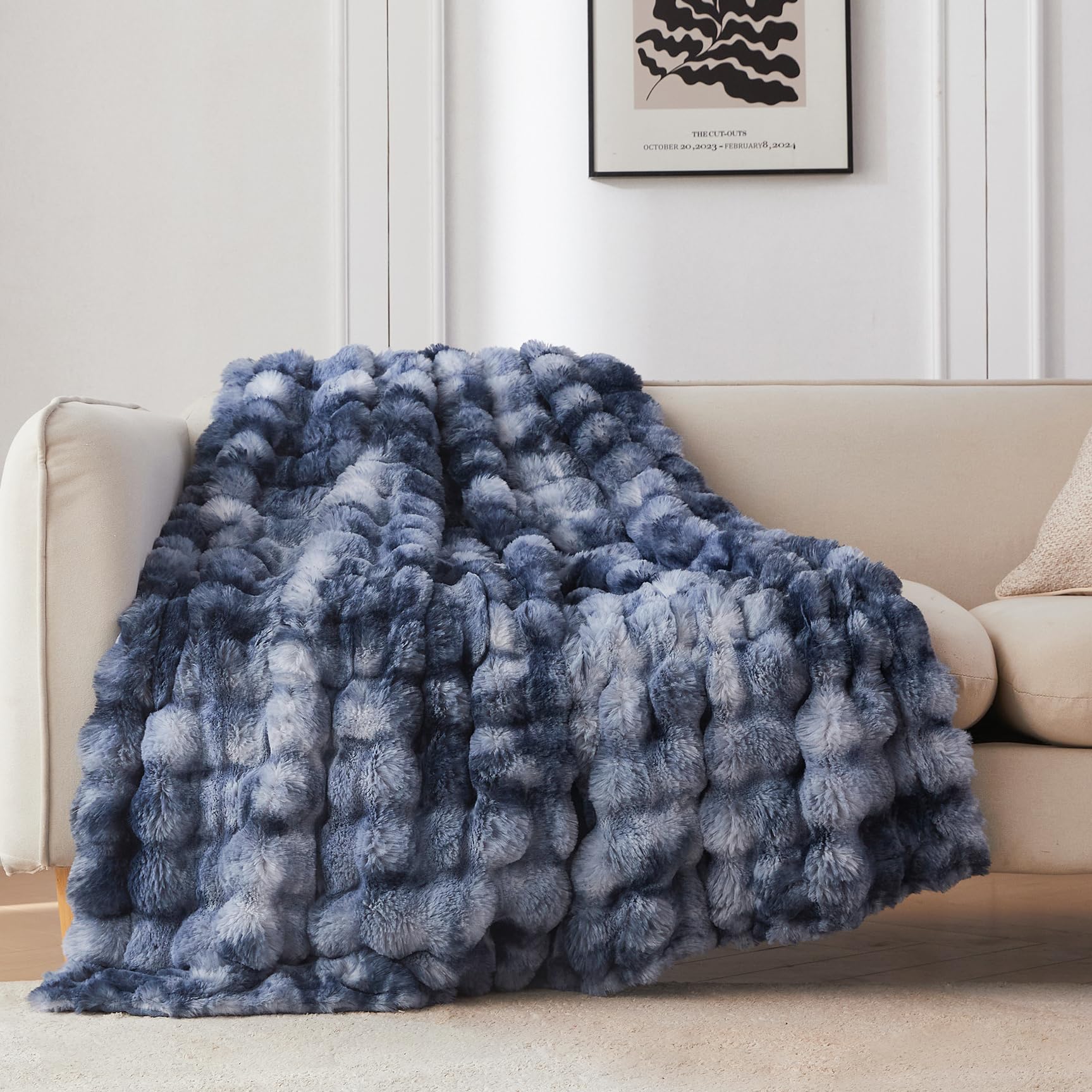 COOVA front view folded throw highlighting tie-dye light blue and plush look