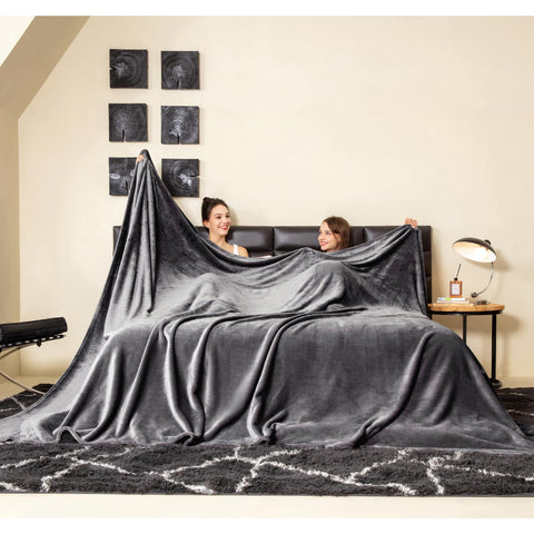 COOVA front view folded blanket showing plush dark grey fabric and storage benefit