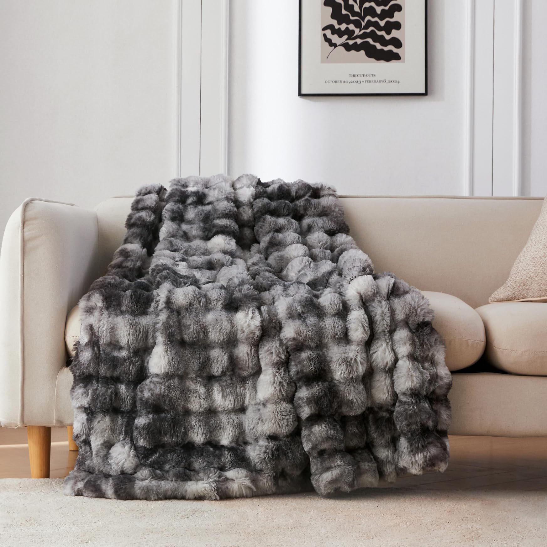 COOVA throw blanket front on sofa showing tie-dye light grey and cozy appeal