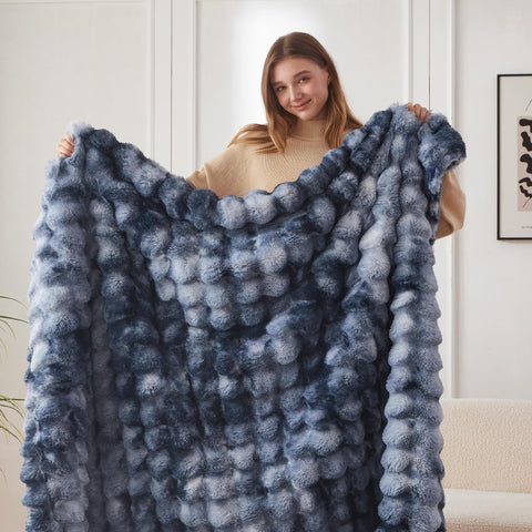 COOVA throw blanket draped over sofa showing cozy living room styling