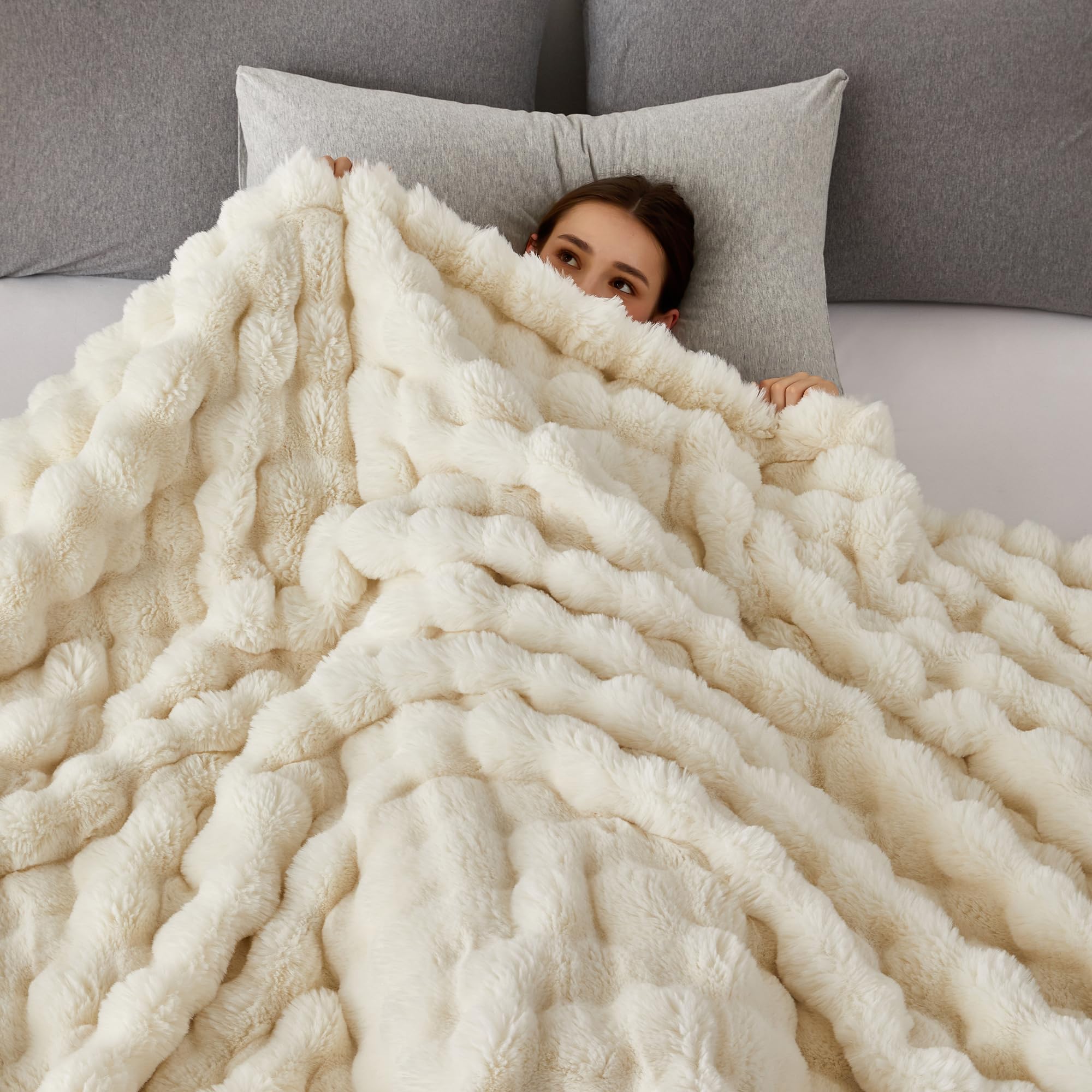 COOVA throw draped over sofa in living room demonstrating cozy styling