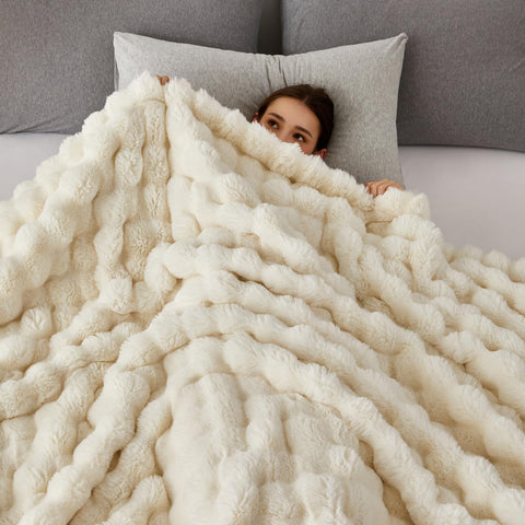 COOVA throw draped over sofa in living room demonstrating cozy styling