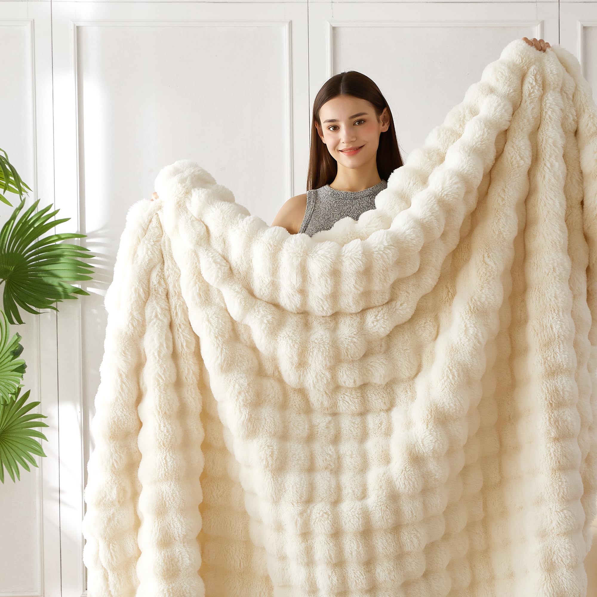 COOVA blanket beside chair to show 60x80 size and real-life scale