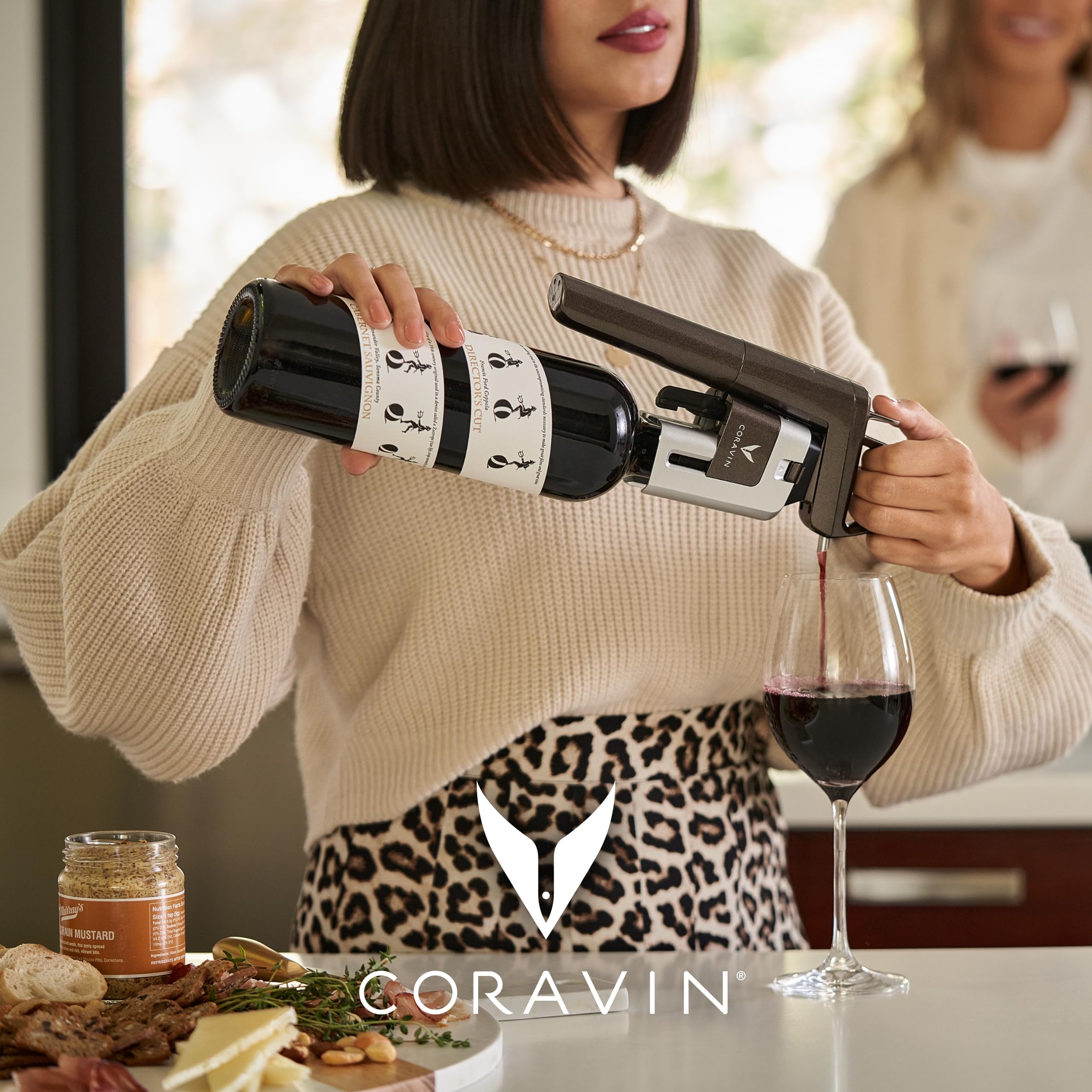 CORAVIN needle in use pouring wine into glass to preserve bottle and pour by the glass