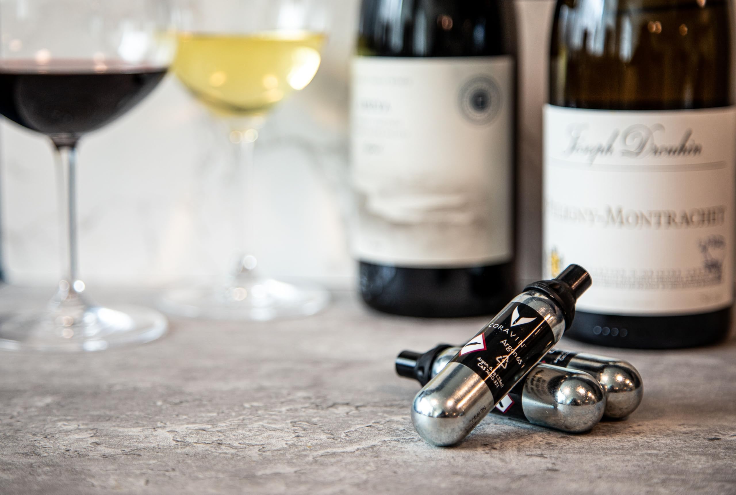Coravin pure argon capsule installed in system pouring wine with protection